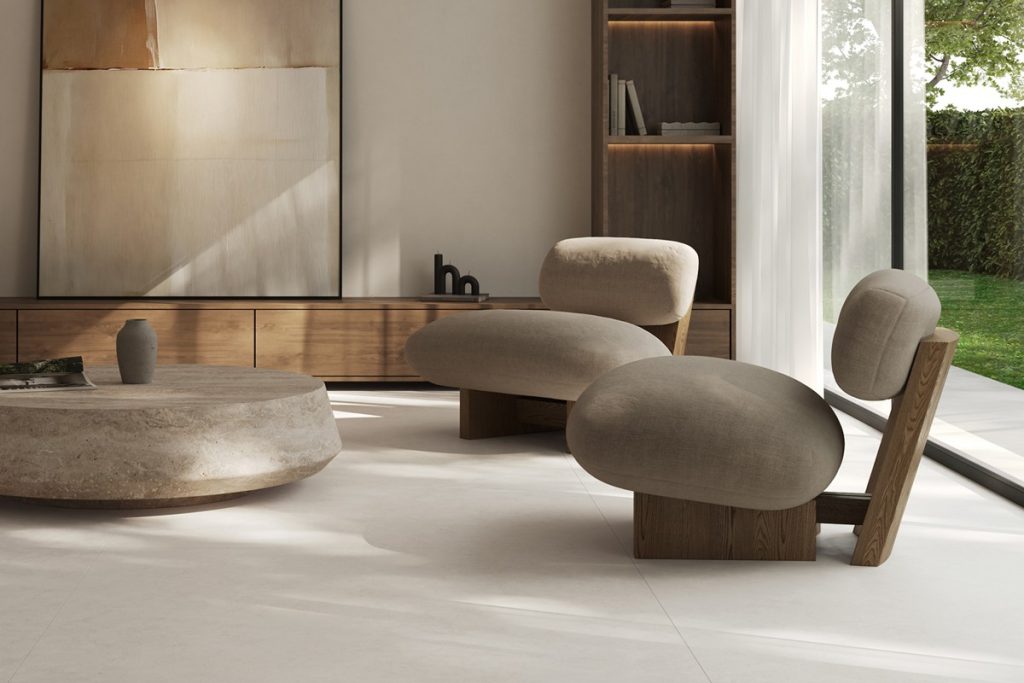 Azuvi Luna living room with pale floor tiles, warm timber and rounded furniture.