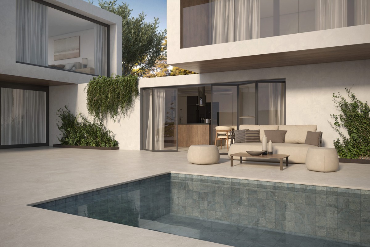 Gres Aragón pool and terrace with an outdoor seating area.